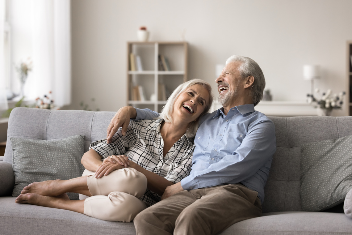 Elderly couple laughing